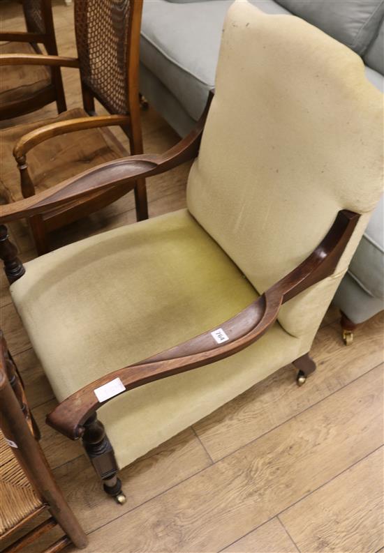 An Edwardian mahogany framed club armchair